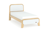 Modern bed with wooden frame and white mattress on a white background