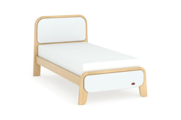 Modern bed with wooden frame and white mattress on a white background