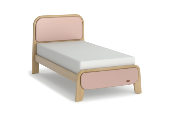 Children's bed with pink and beige design on a white background