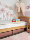 Eco Kids Mattress pictured on a Cherry and Almond coloured Boori Bronte Bed frame