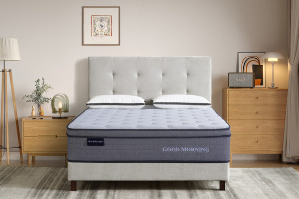 Grey mattress with 'Good Morning' branding in a bedroom setting.