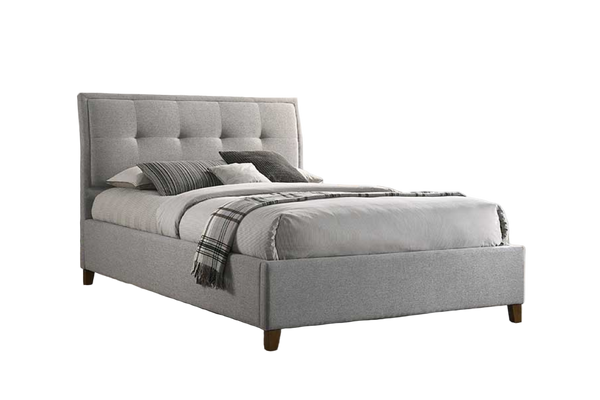 Light Grey queen size upholstered fabric bed with plaid blanket and pillows on a white background