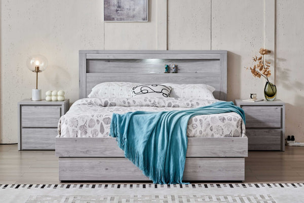 Front view of Belleville Queen bed frame with one foot-end drawer and two side drawers closed