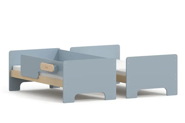 Boori Neat Single Bunk Bed split into two single beds in Blueberry and Natural - one bed with guarded sides, one open, showing the bunk-to-singles conversion.