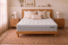 Sealy Posture Luxe Medium mattress in a light timber bedframe with cream linen pillows - Australian made, Best in Beds Sydney
