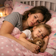 Exhausted mum lying in child's bed after night wake-ups and disrupted sleep routine