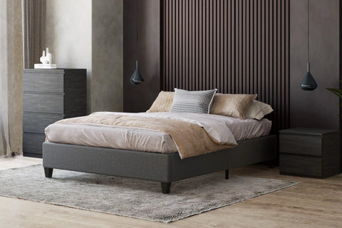 The Bulli Platform Bed is an elegant design that adds modern day charm to your bedroom. Upholstered in a dark grey fabric with a sleek finish, the solid plywood slats provide excellent support and comfort for a great night's sleep. Features: MDF - Sustainably harvested timber - Available in Single, Double or Queen size