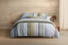 Inspired by lazy days spent seaside, our Halston Quilt Cover Set is reminiscent of awning-striped deck chairs and beach umbrellas. A versatile colour palette with summery shades throughout, it lends itself to versatile styling. For twice the fun — and the styling — the reverse features a horizontal stripe in a neutral colourway. Printed onto cotton sateen.