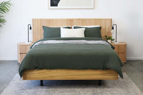 Lynda Bed Frame - Experience the ultimate combination of style and comfort with our Lynda Bed. This stunning bedroom piece boasts a sleek bedhead and modern curved design, crafted from durable MDF and Australian Messmate wood. Its natural beauty and durability promise to elevate your bedroom into a cozy and dreamy retreat.