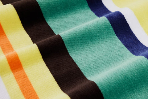 Jump into summer with the Sheridan Sunside Beach Towel! Perfect for a day at the beach, this unique towel has a vintage-inspired stripe pattern, plush velour front and absorbent terry reverse crafted from cotton. Get ready to soak up the sun in style!