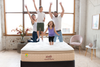 Family jumping on a Yinahla Visco Flex Mattress & Bed Base Ensemble Package. Medium-firm, the solution for sleepers seeking relief for sore spines, joints & aching backs. 20-year warranty.