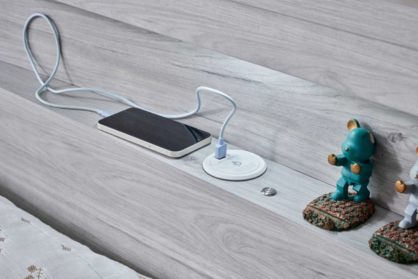 USB-A charging cable connected in the Belleville bedhead bookshelf