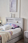 Belleville King Single bed in Cement Grey showing the bedhead shelf and closed trundle