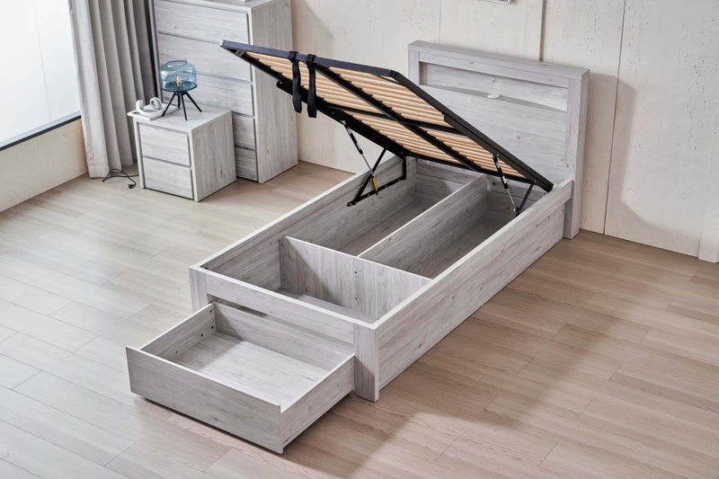 Belleville King Single front gas lift bed with raised platform and open end drawer in a bedroom