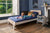 Boori Natty king single kids bed in white and oak with child reading in navy bedroom, Best in Beds Campbelltown Sydney