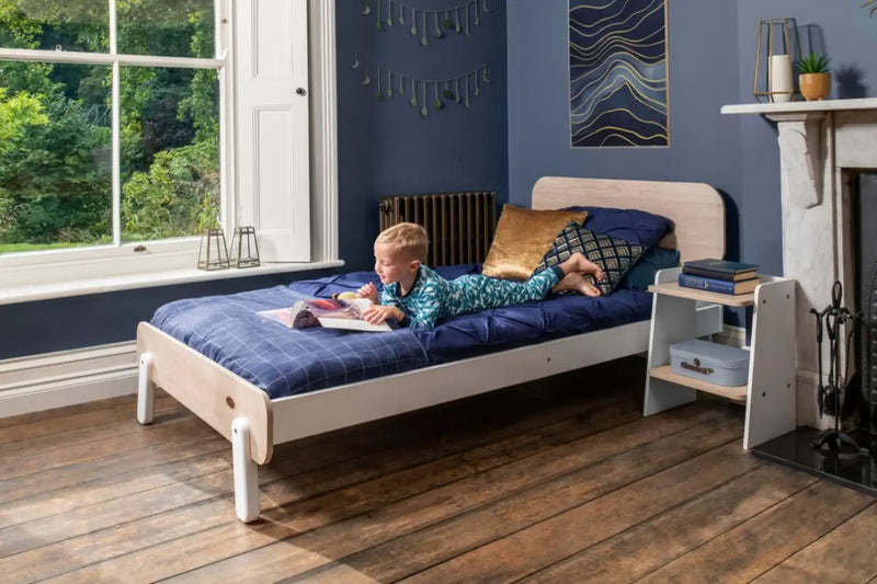 Boori Natty king single kids bed in white and oak with child reading in navy bedroom, Best in Beds Campbelltown Sydney