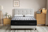 Morrison Mindfulness Mattress pictured on an upholstered bed frame in a light grey coloured fabric with buttoned headboard available to be purchased seperately