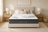 Morrison Signature Dream mattress with quilted pillow-top, styled in a sun-dappled bedroom with neutral pillows, oak bedside tables and a woven rug