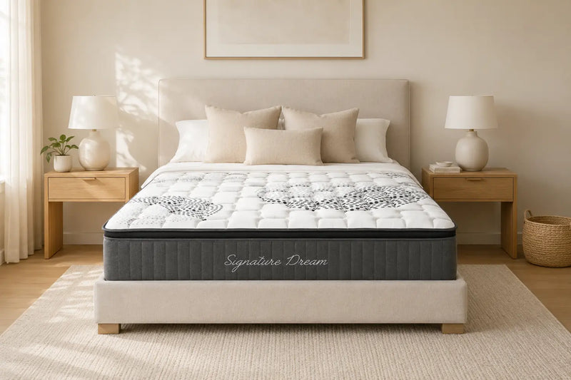 Morrison Signature Dream mattress with quilted pillow-top, styled in a sun-dappled bedroom with neutral pillows, oak bedside tables and a woven rug